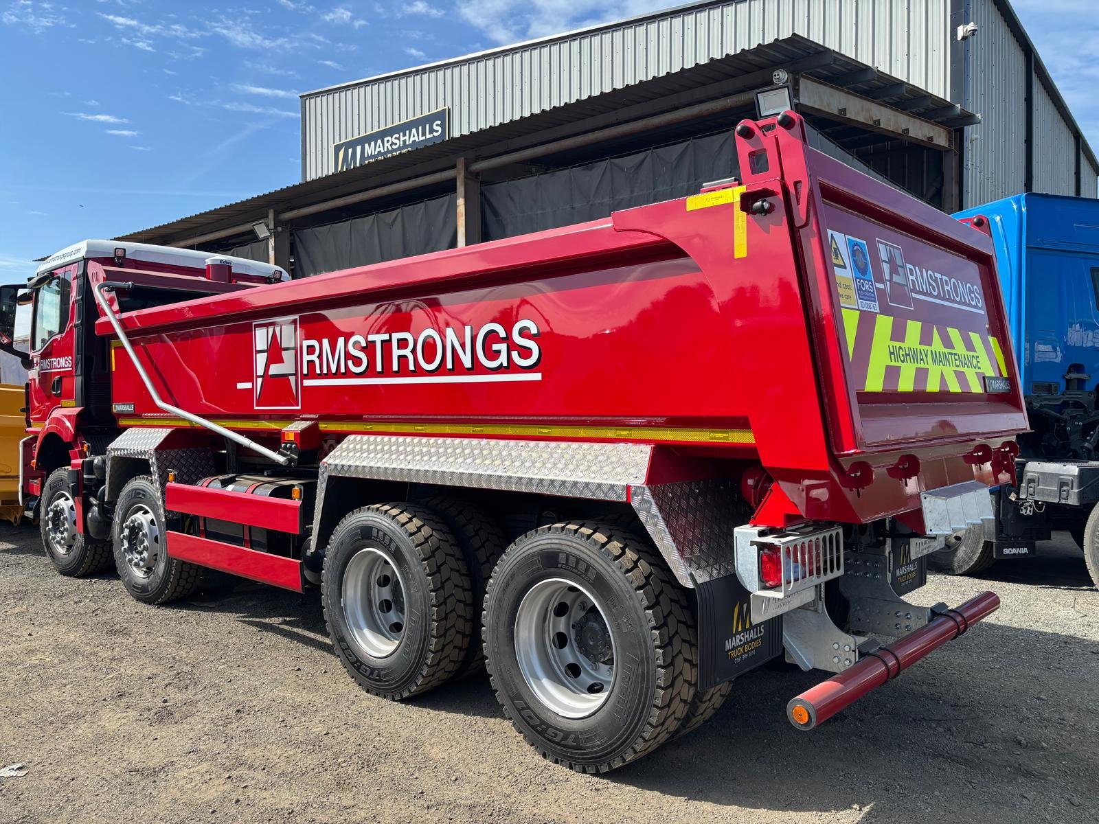 Red painted tipper truck