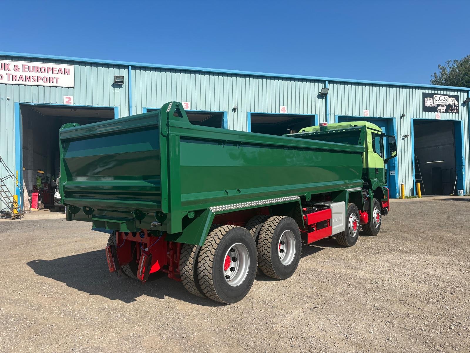Green commercial tipper after repainting