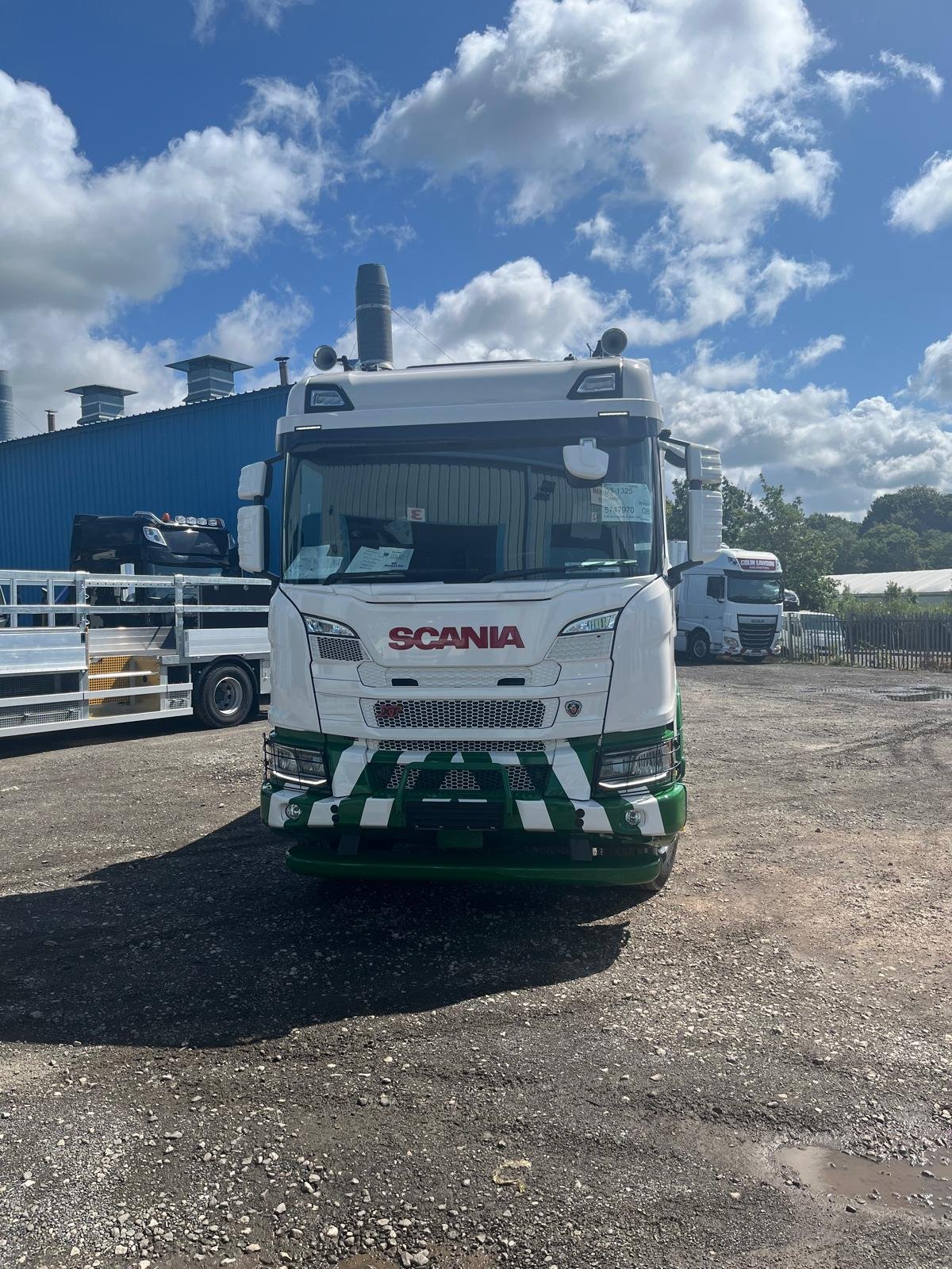 Green and white Scania tipper after paintwork