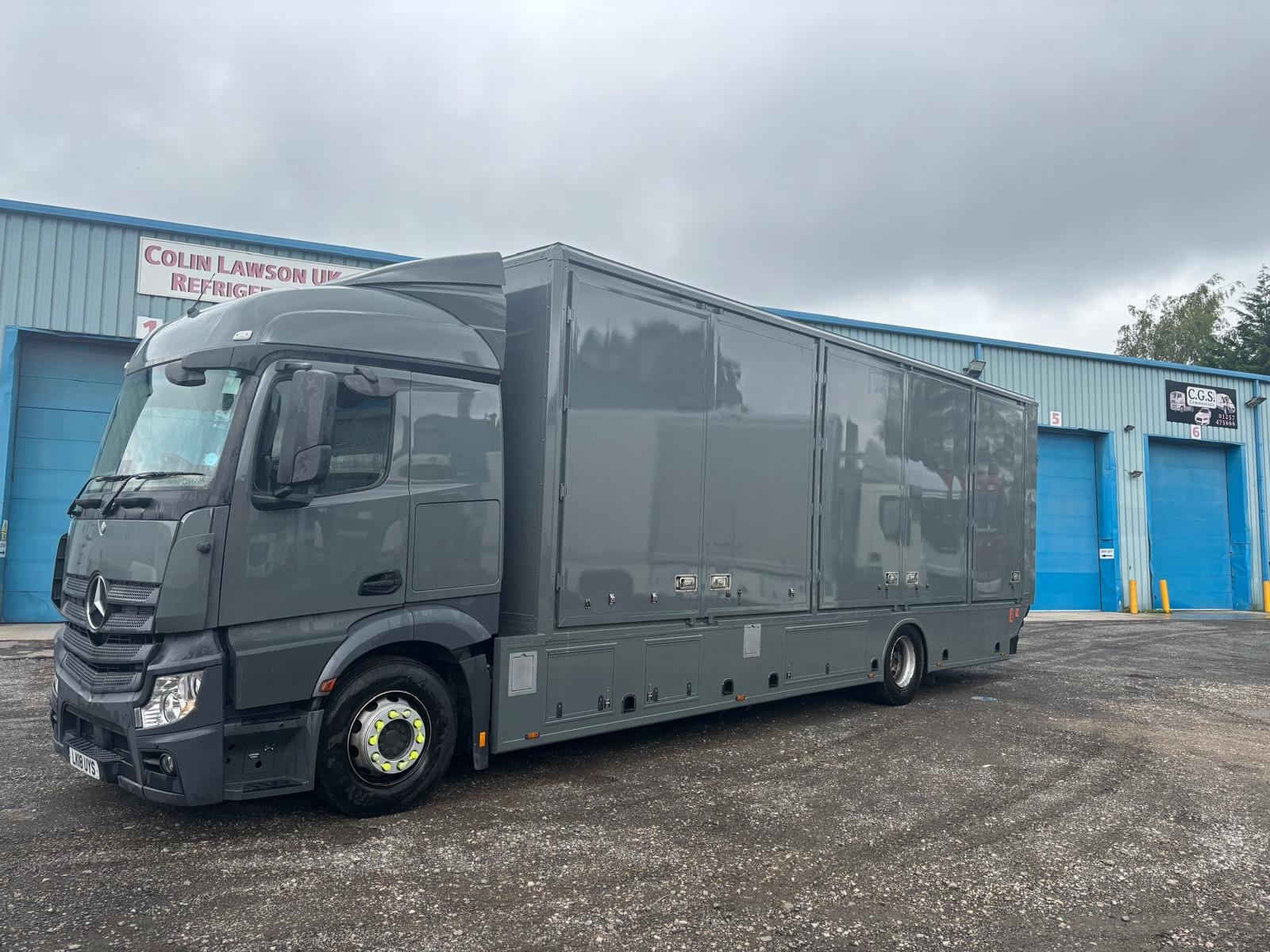Grey mobile unit showing the completed side refurbishment