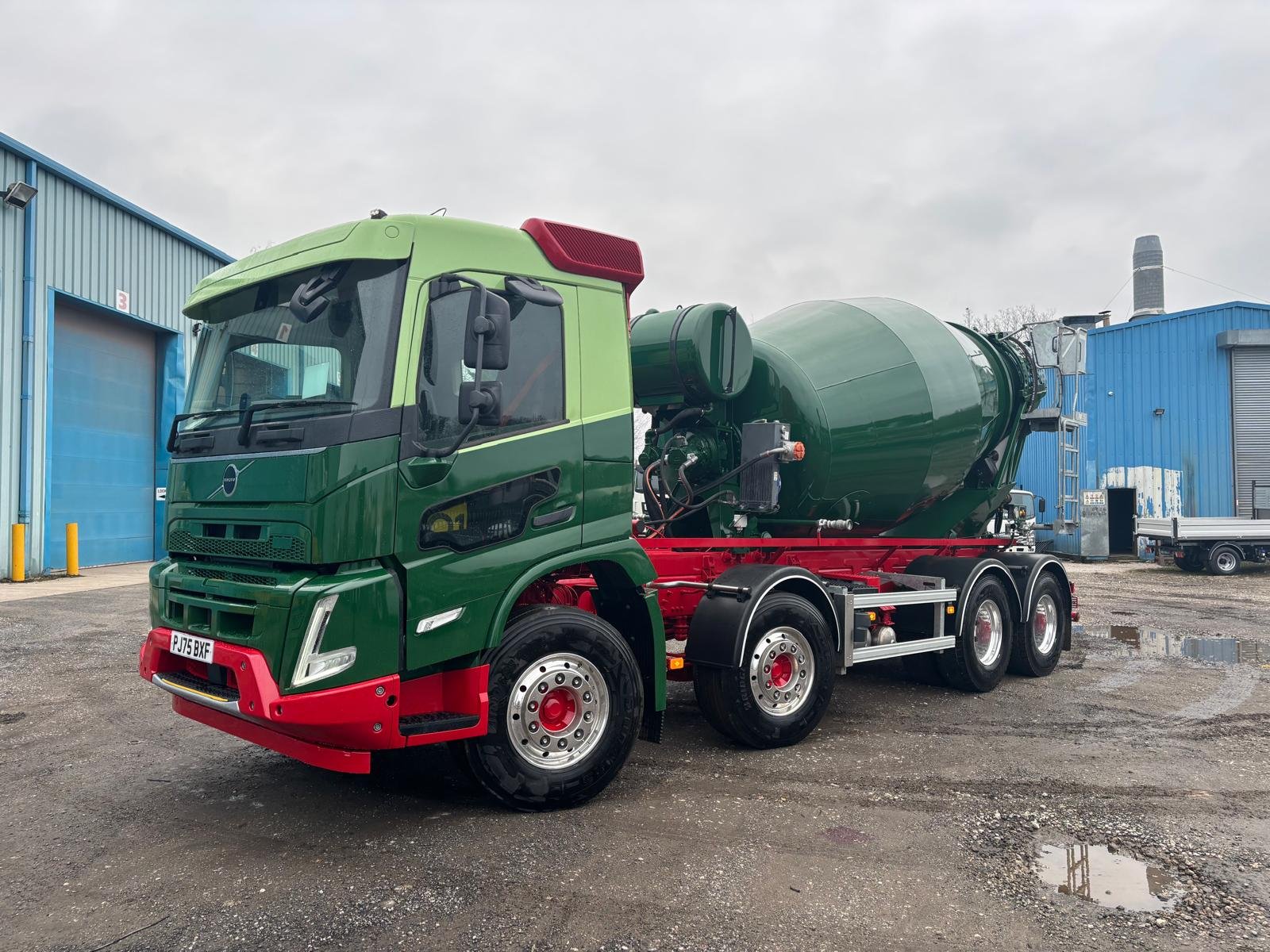 Green concrete mixer with completed commercial paint finish