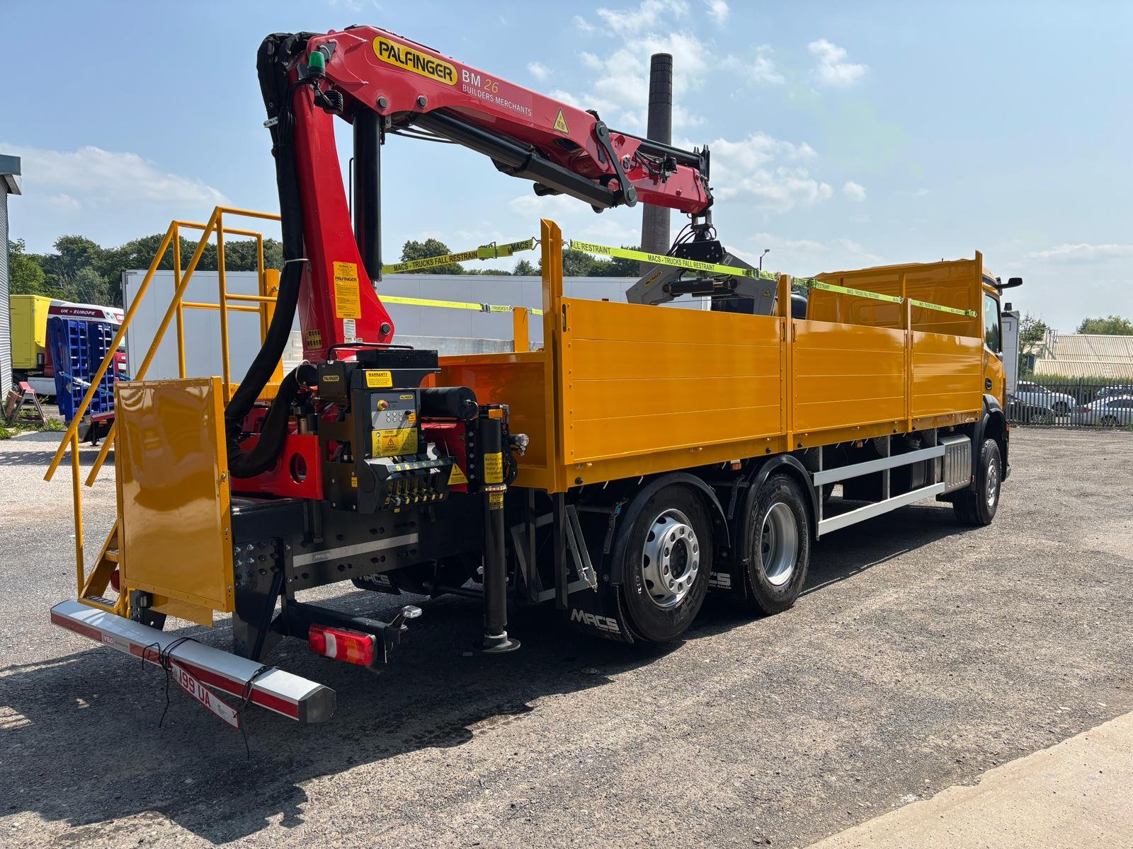 Yellow commercial crane dropside with completed paintwork