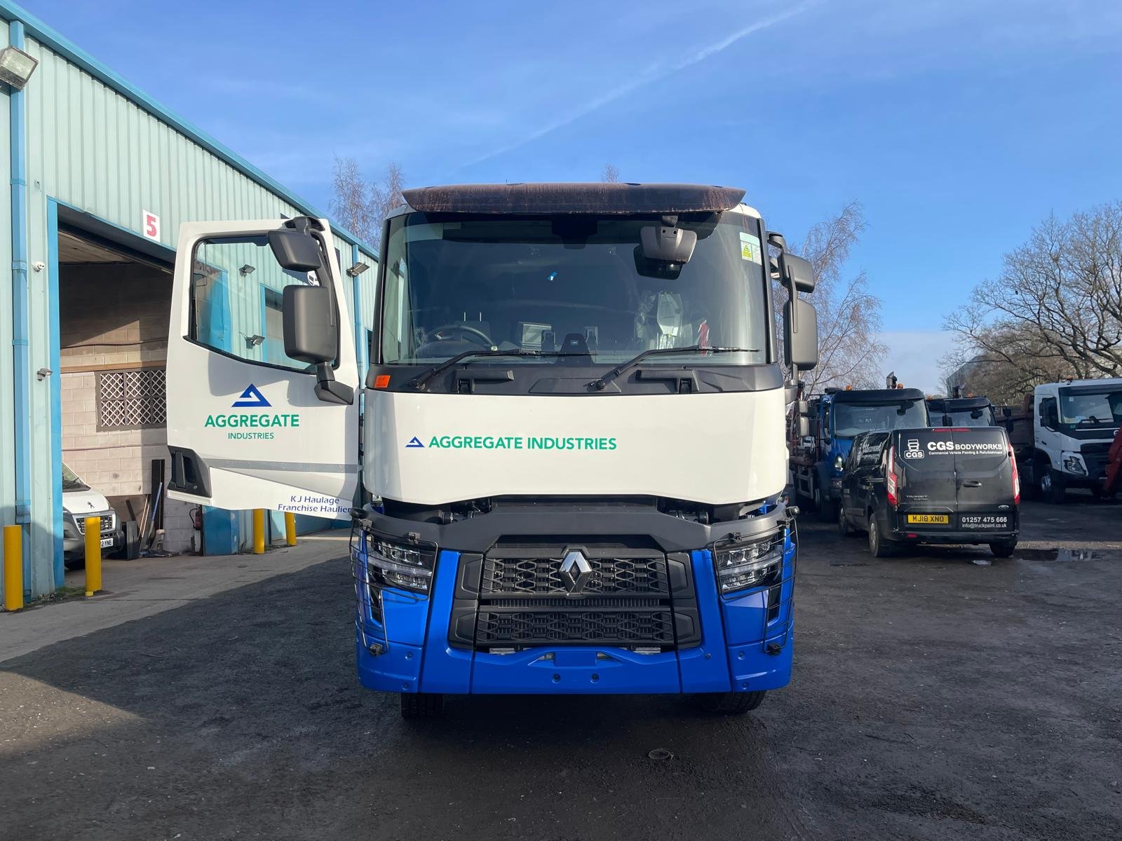 White and blue aggregate tipper with commercial paint finish